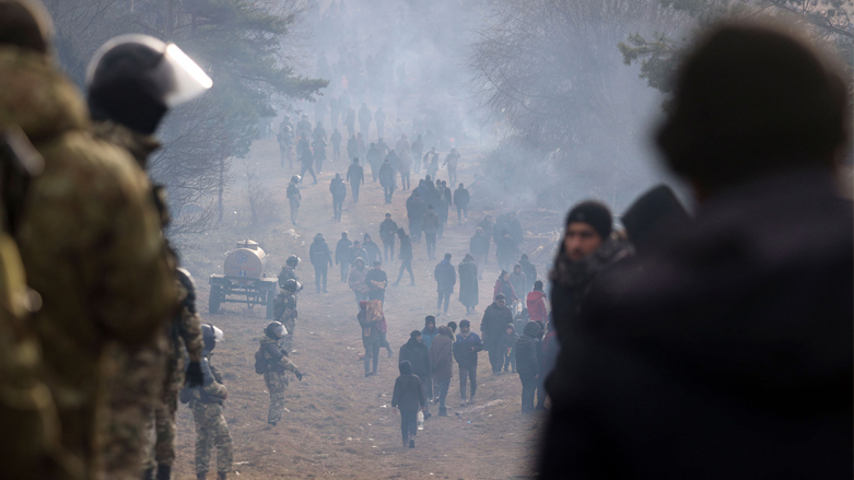 Belarusian servicemen guard an area as migrants gather at the Belarus-Poland border near Grodno, Belarus. (Photo: Leonid Shcheglov/AP)